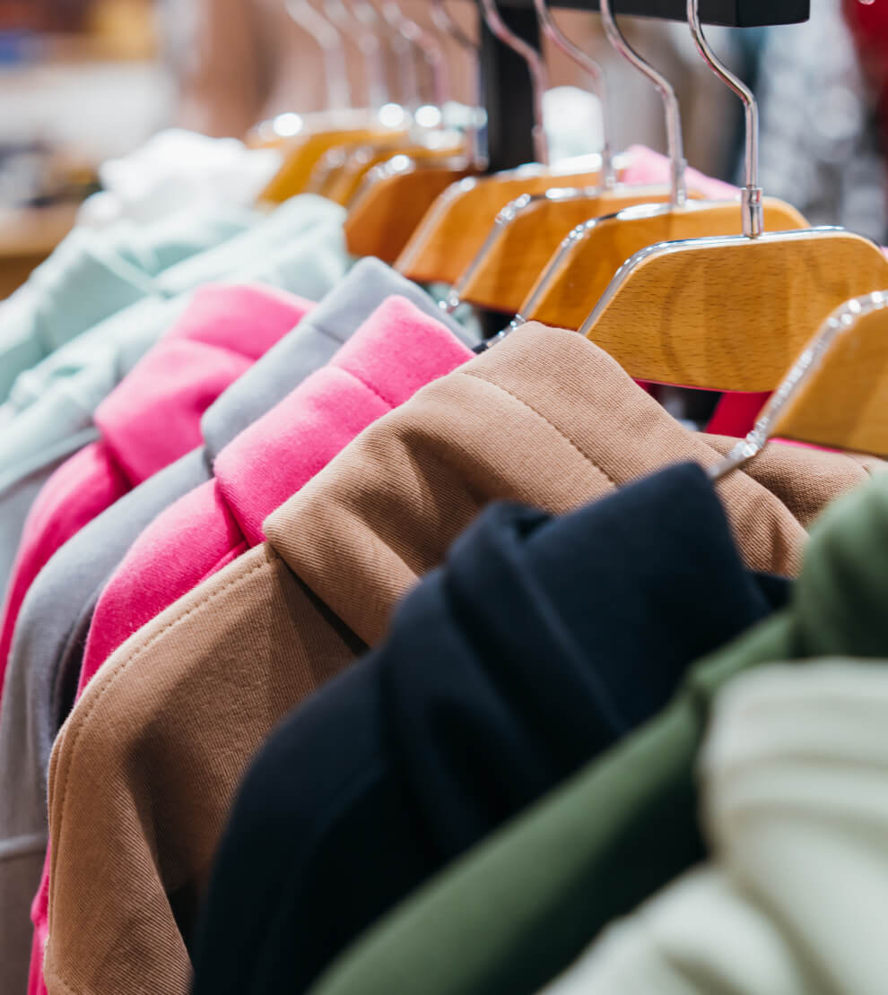A rack of clothes hanging on a clothes rack.