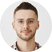 A man wearing glasses and a plaid shirt.