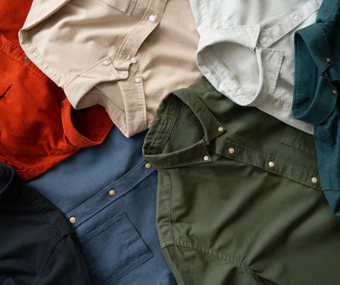 A pile of clothes sitting on top of each other.