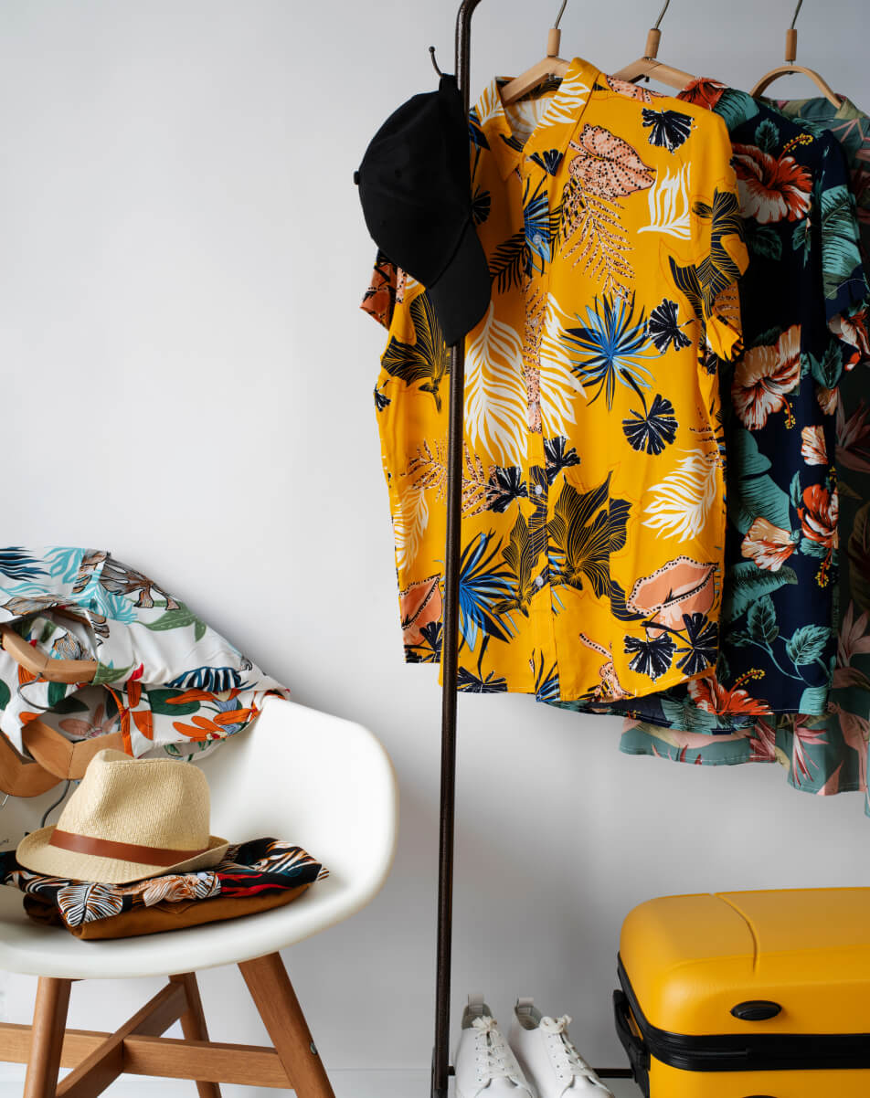 A yellow suitcase sitting next to a yellow suitcase.